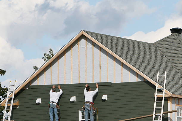 Professional Storm Damage Siding Repair technician working in Wellington, TX